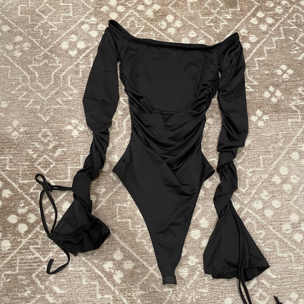 Black bodysuit off the shoulder top with bell sleeves. So cute 😍